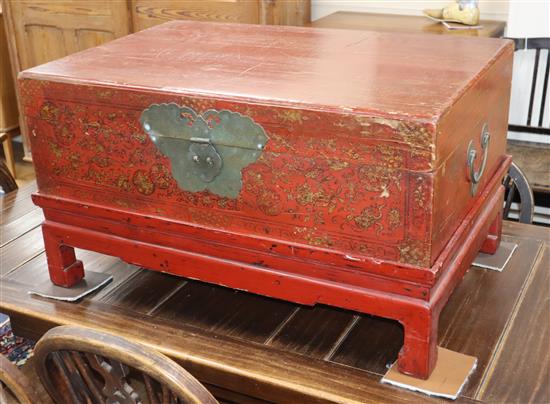 A Chinese lacquered box on stand W.80cm